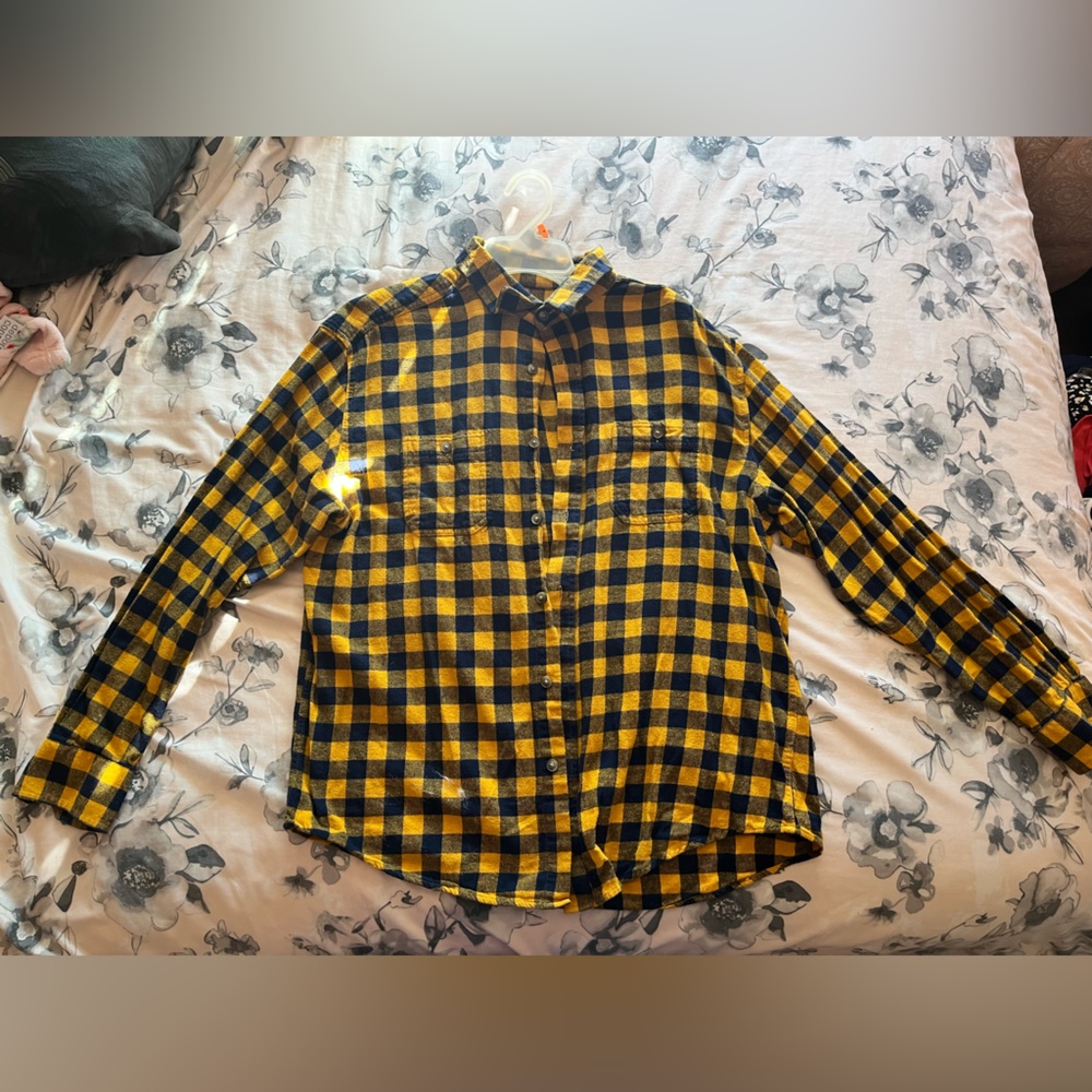 A thick yellow and navy blue men’s flannel.